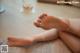 A close up of a person's bare feet on a table.