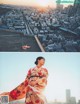 A woman in a kimono standing on top of a building.